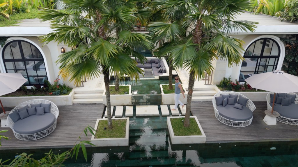 Luxury home courtyard with pool and tropical palms